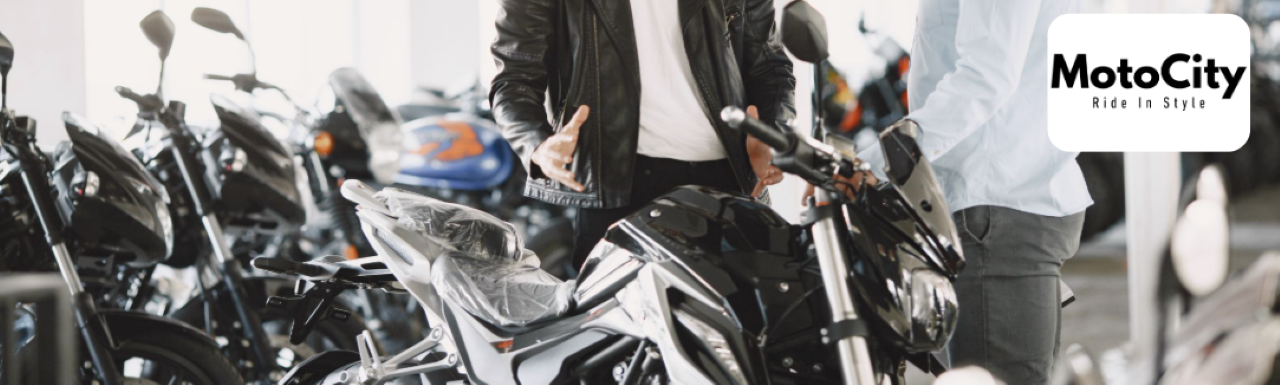 A MotoCity mechanic performing expert repairs on a motorcycle at the Daytona Beach location.